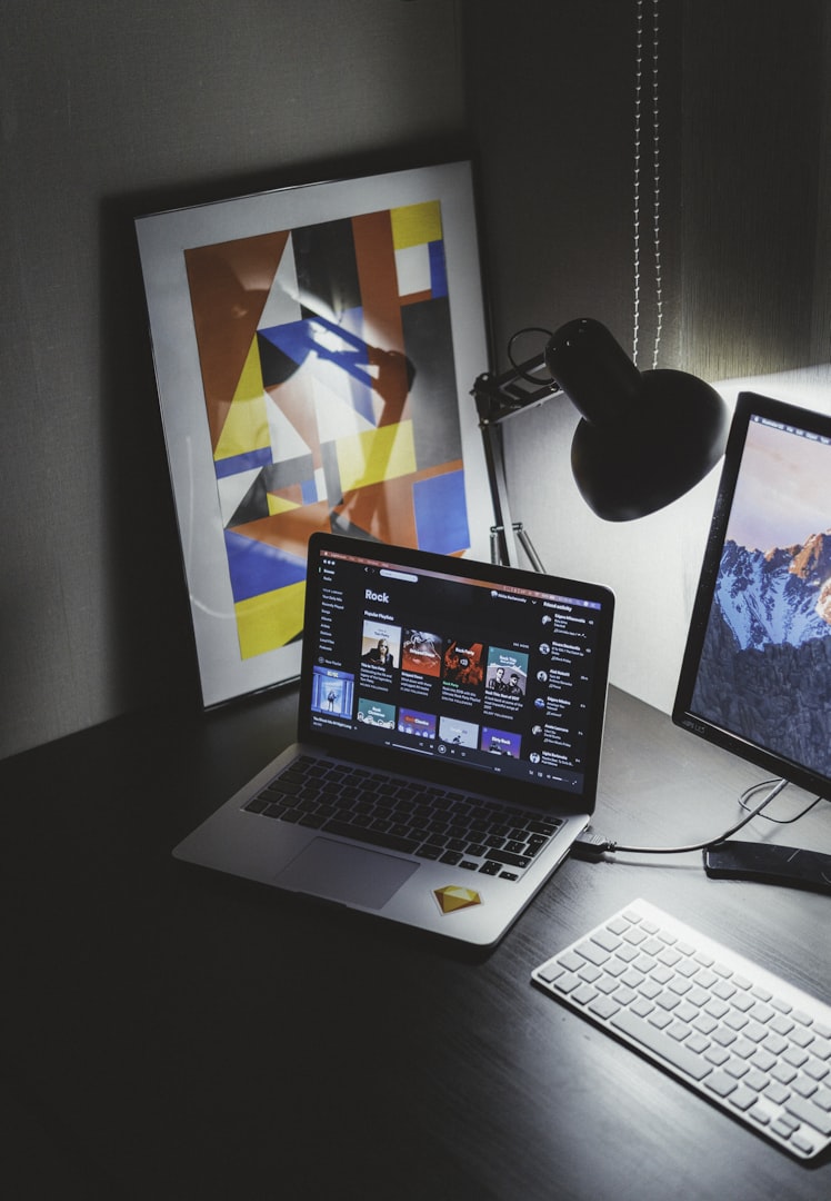 Graphic designer working at desk by Petes Printing