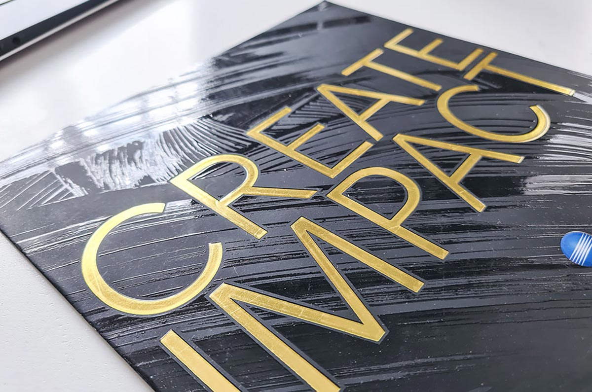 Spot UV and gold foil flyer close-up by Petes Printing UK